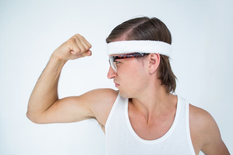 Geeky hipster posing in sportswear