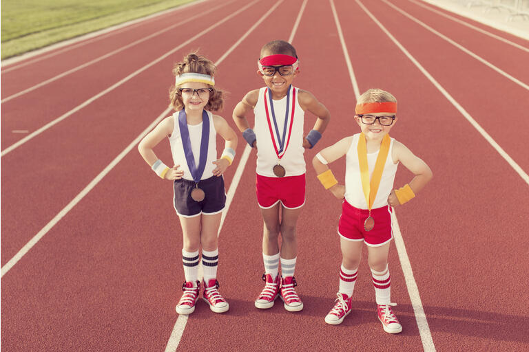 Children Dressed as Nerds at Track Wearing Medals