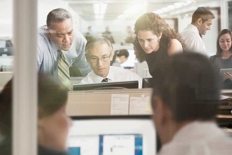 Business people working at computer in office