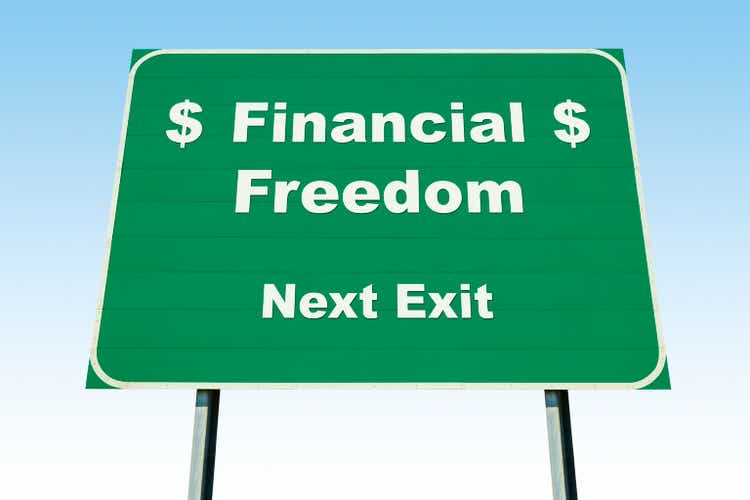 Highway Road Sign; Financial Freedom Next Exit