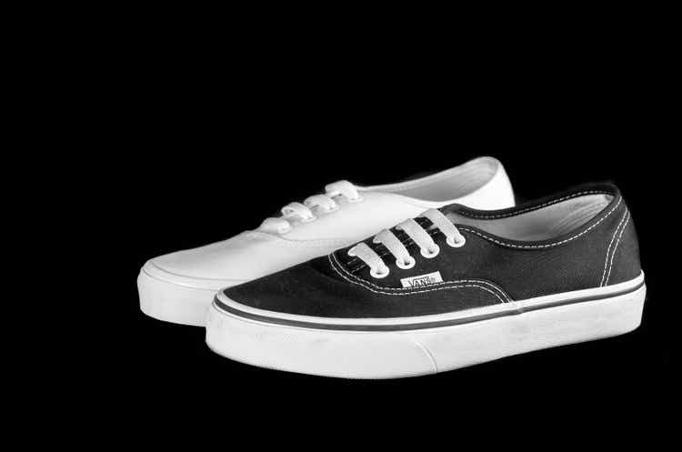 Black and White Vans sneakers isolated on black