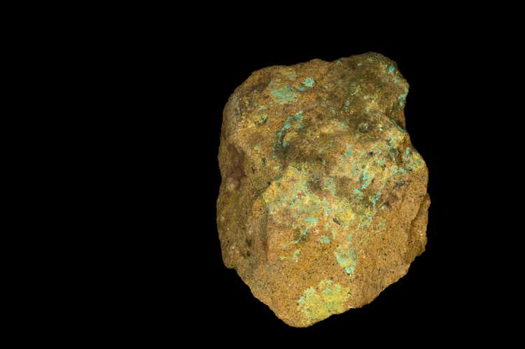 Museum mineral series: Uranium ore isolated on black. 9cm high.