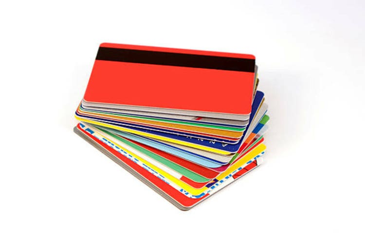 stack of discount cards isolated on white background with shadows