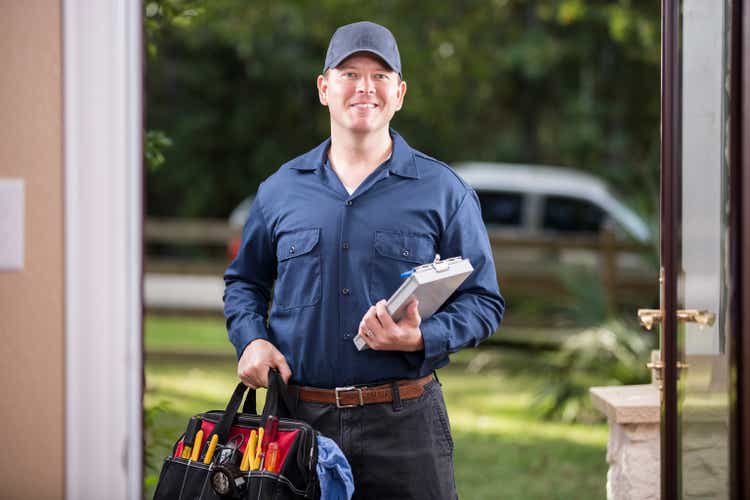 Service Industry: Repairman at customer"s front door.