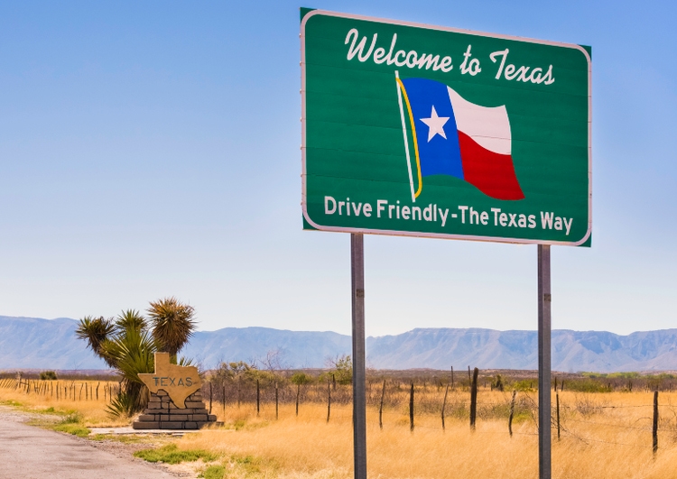 Welcome to Texas and Drive Friendly road sign