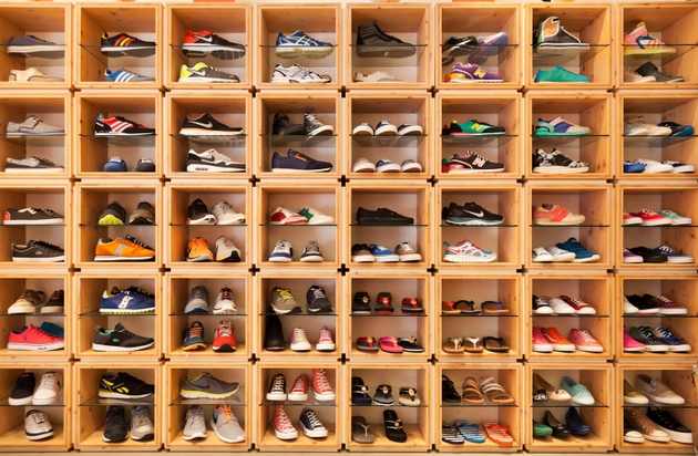 Different shoes displayed in a shoe shop.