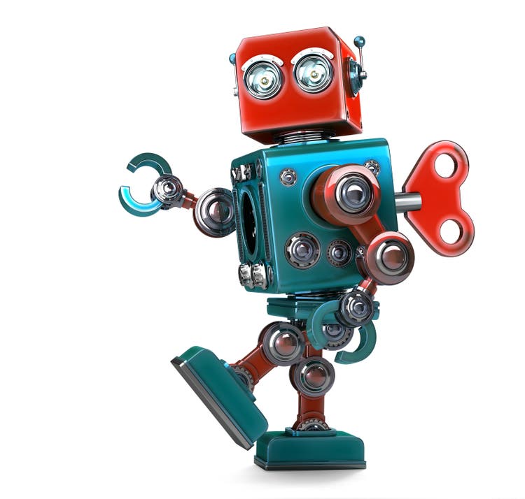 Retro Robot wound up with key. Isolated with clipping path