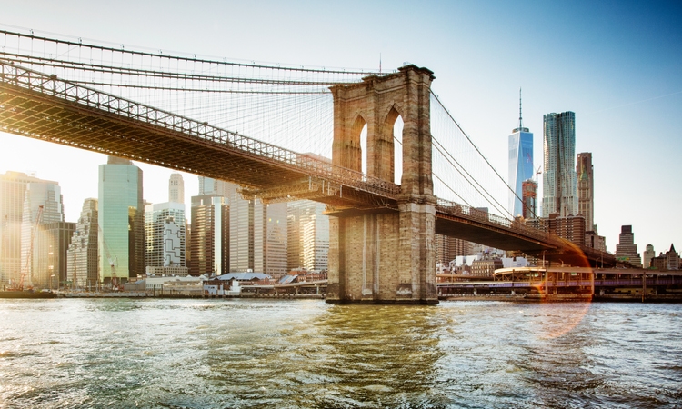 Brooklyn bridge from East river sunset with flare