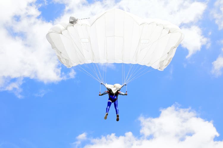 Parachutists in air
