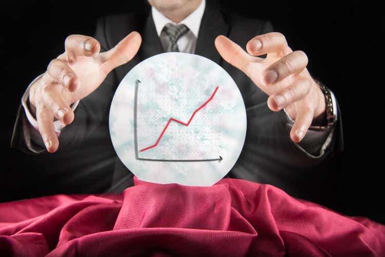 Fortune teller businessman, sees rising graph in a crystal ball