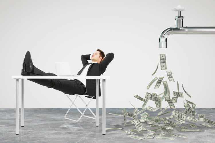 Businessman resting on a chair and faucet from