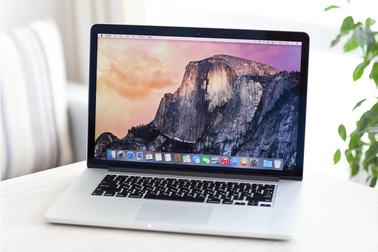 Laptop on white table