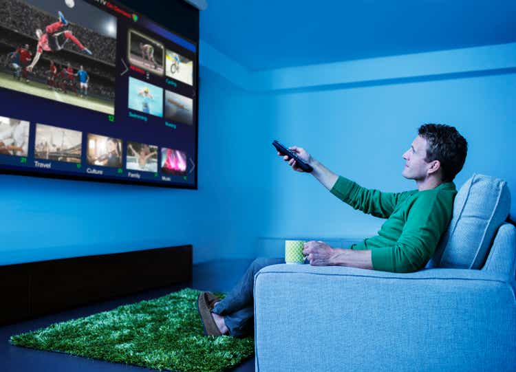 Man watching television in living room