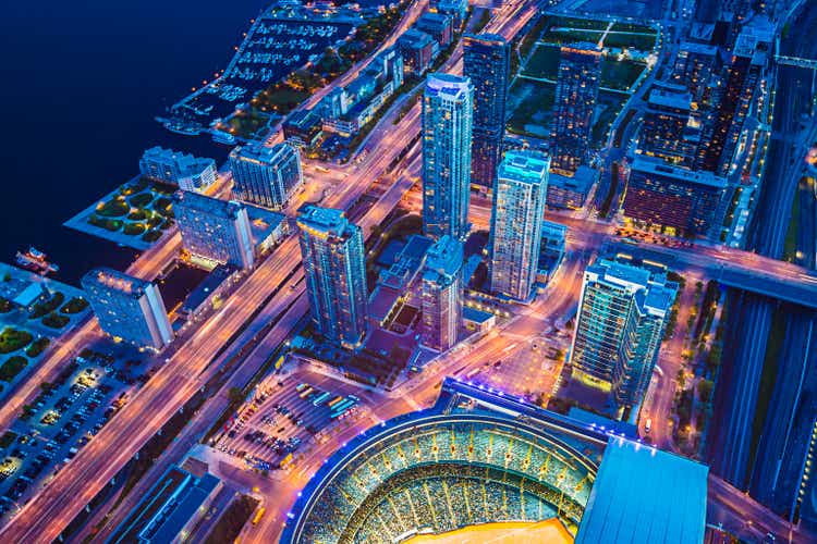 Toronto cityscape with baseball stadium at dusk