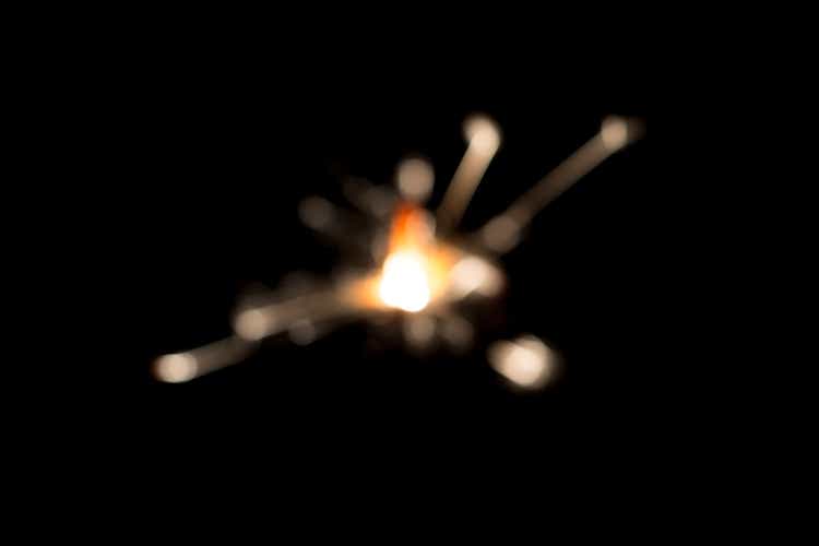 defocused Sparks from a sparkler against black