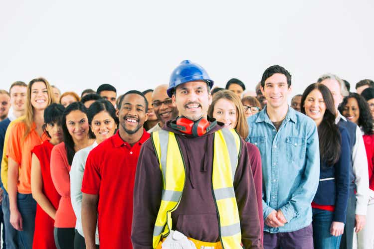Confident Image Of Construction Worker And Crowd