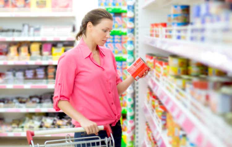 Woman checking food labelling