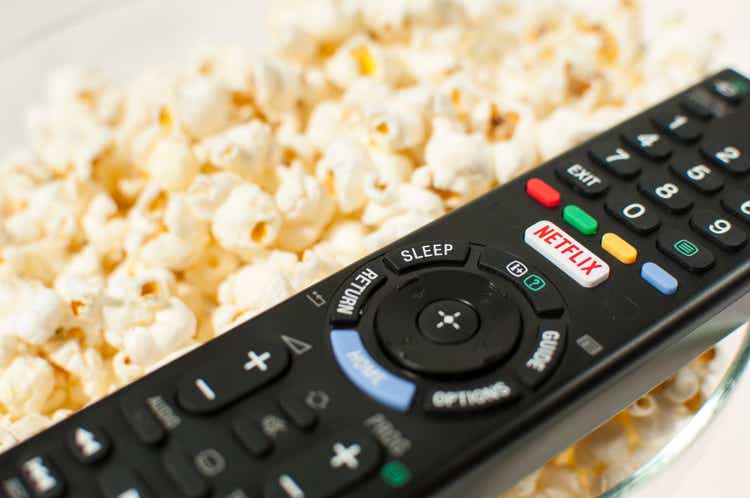 Remote control smart TV with Netflix button with popcorn.