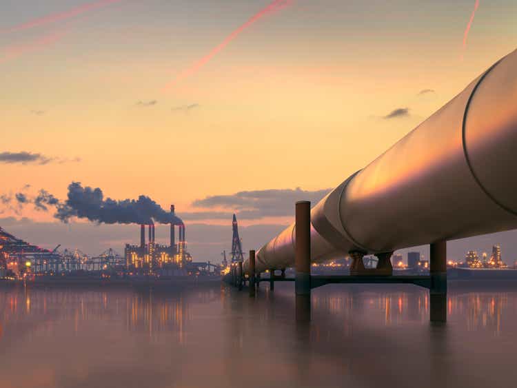 Oil pipeline in factory industrial area at dusk