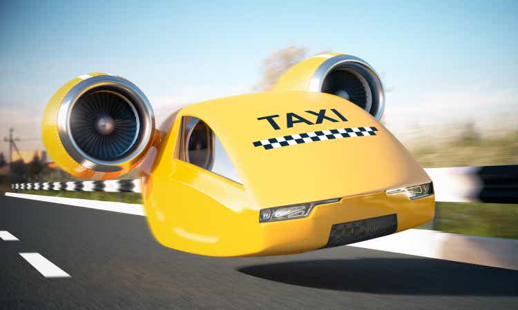 Fast yellow taxi car driving on a highway