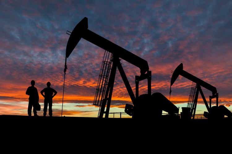 Silhouettes of Pumpjacks and Oil Workers