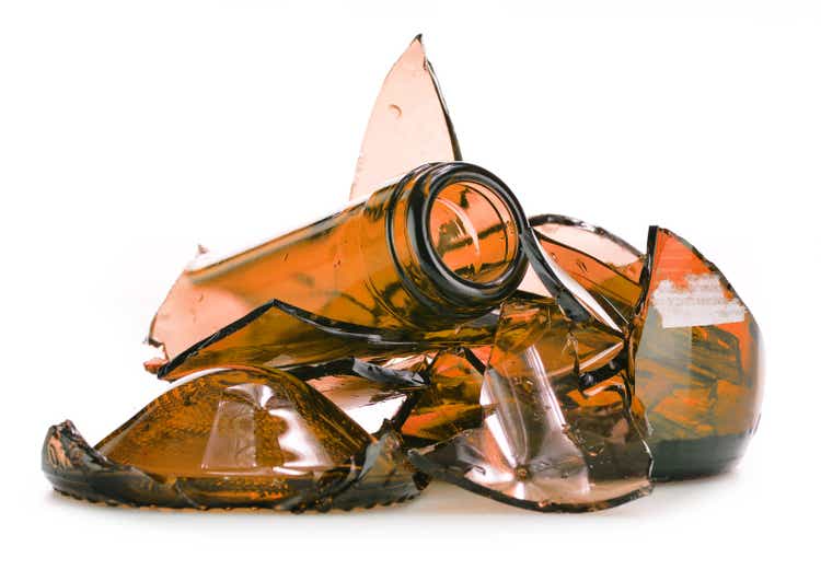 Pieces of broken glass over white background. Recycling