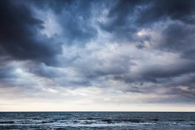 Dramatic stormy dark cloudy sky over sea