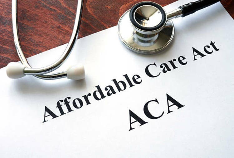 Words Affordable Care Act ACA written on a paper.