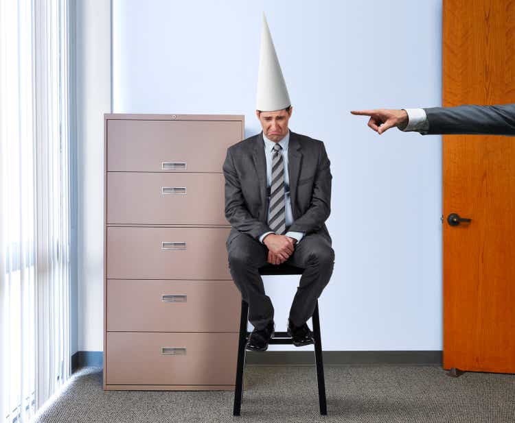 Businessman with Dunce Cap