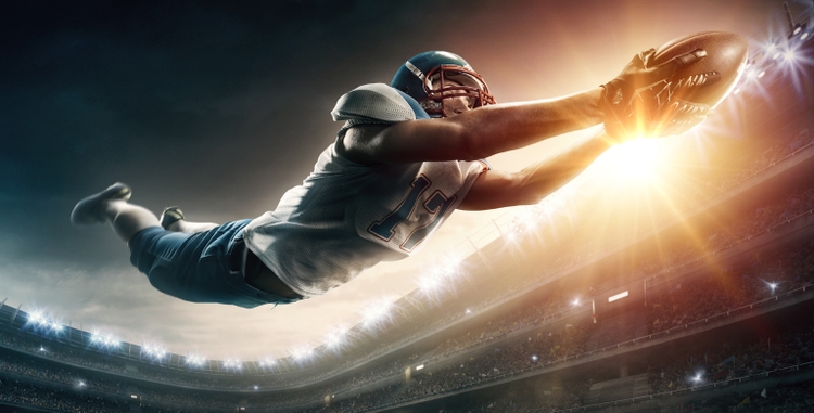 American football player jumping