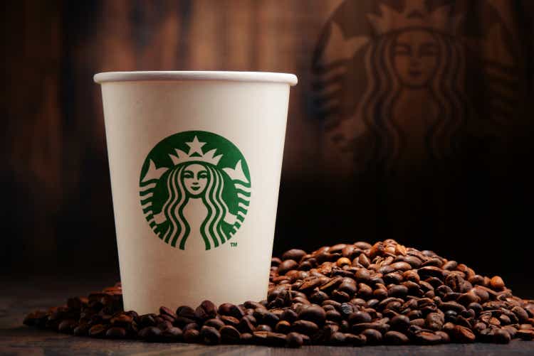 Composition consisting of a cup of Starbucks coffee and beans