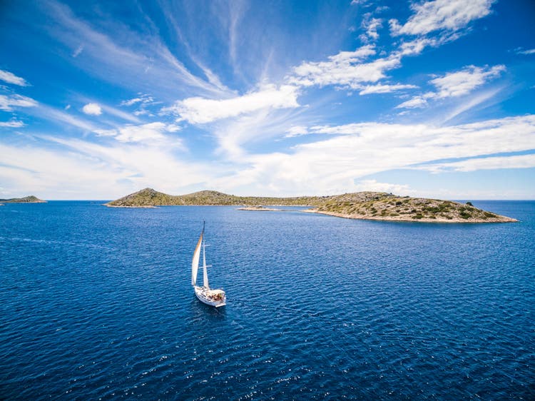 Sailing with sailboat, view from drone