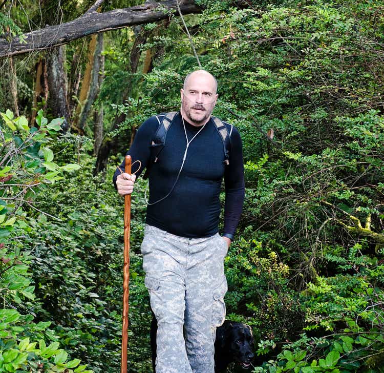Man Hiking Using Oxygen Therapy