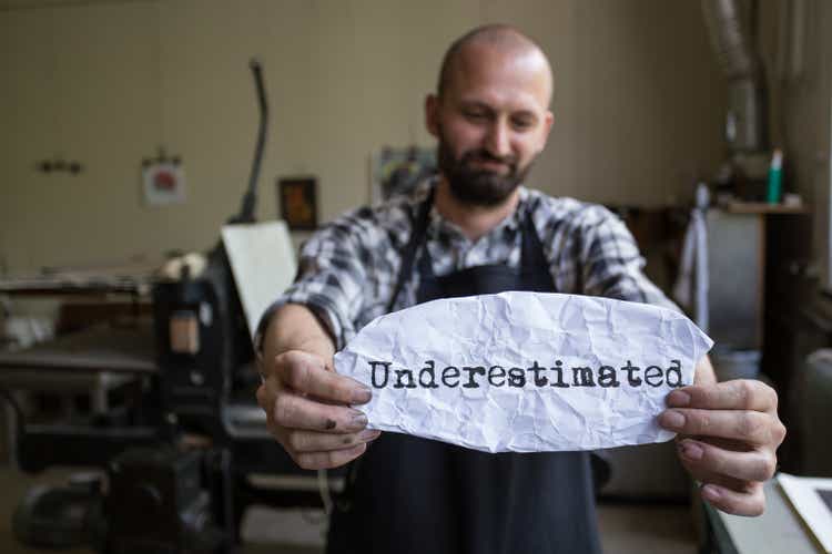 Male worker holding a sign 