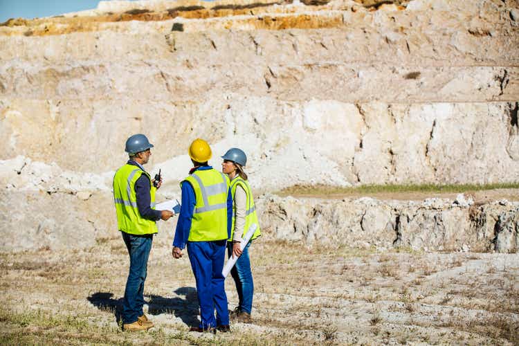 Construction team talking at quarry