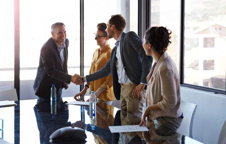 Businesspeople shaking hands before meeting