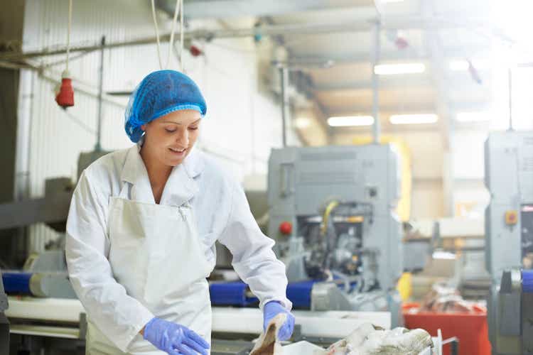 Smiling worker working in fishing industry