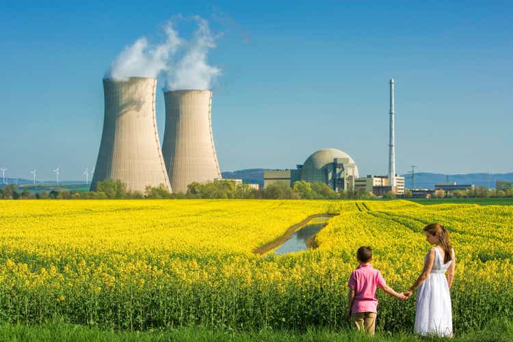 Mother Holding Hands with Son at Nuclear Power Station