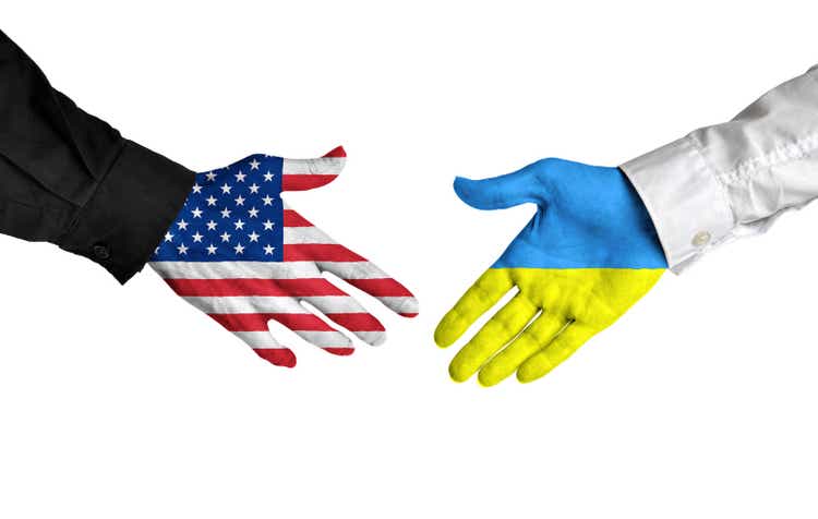 United States and Ukraine leaders shaking hands on deal agreement