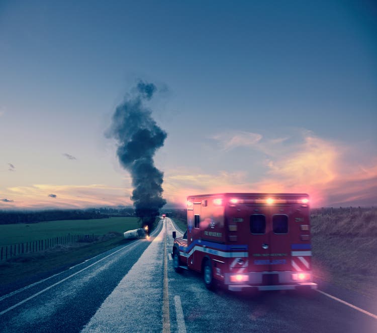Ambulance driving to car crash