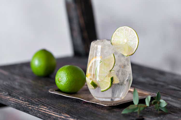 Cold cocktail with lime, lemon, tonic, vodka and ice