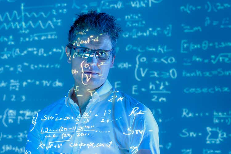 Portrait of scientist with projected mathematical data