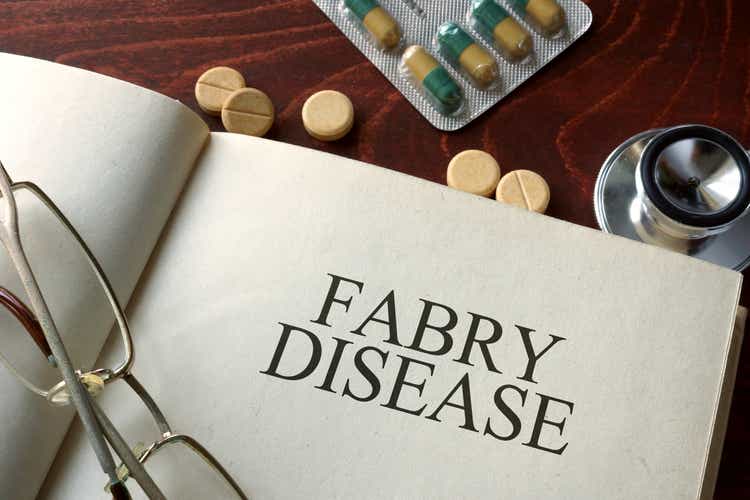 Book with diagnosis Fabry disease and pills. Medical concept.