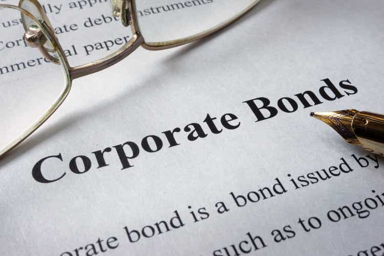 Corporate bonds read on the newspaper page.