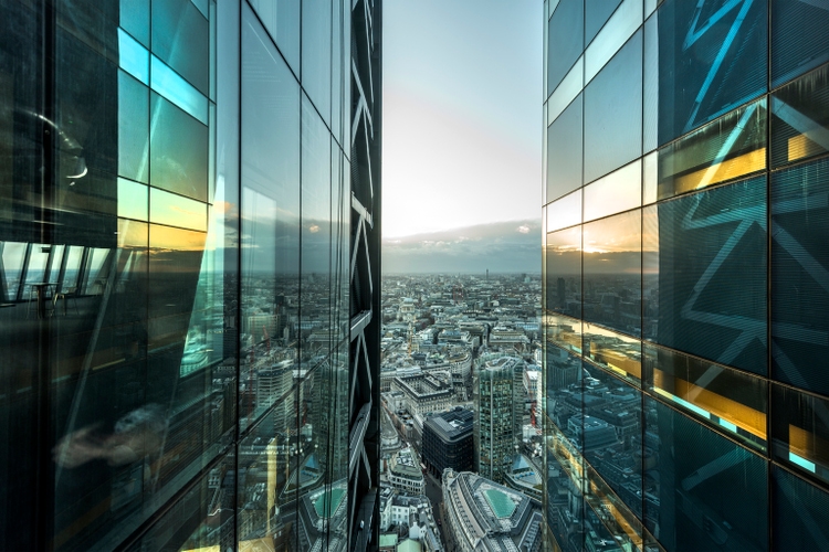 aerial of city with glass building