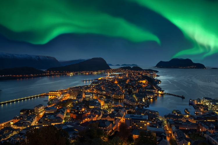 Northern lights - Green Aurora borealis over Alesund, Norway