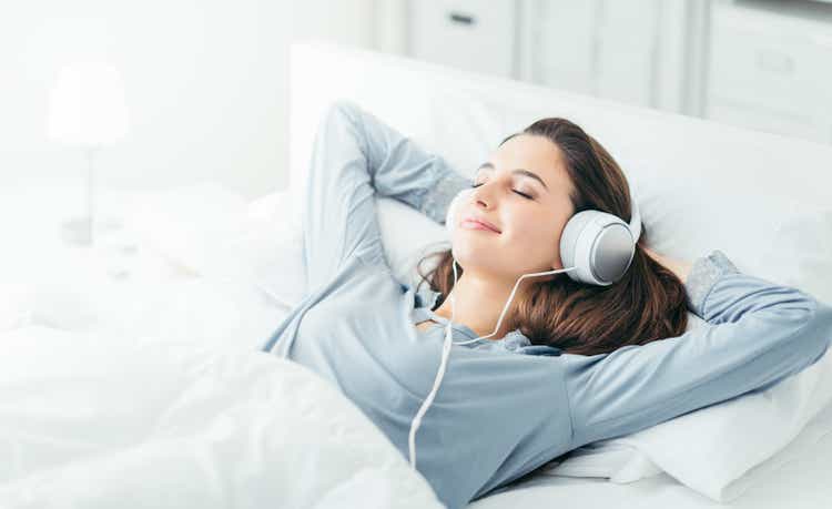 Young woman relaxing in bed