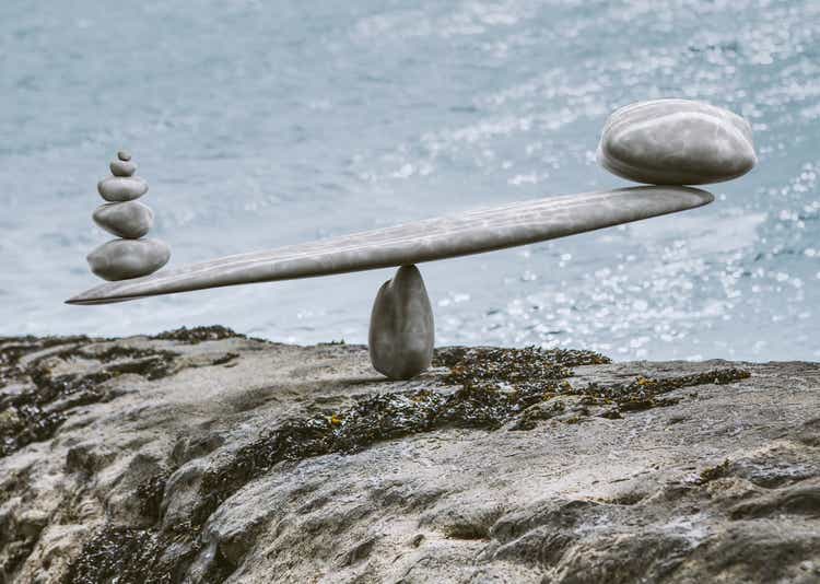 zen-like stone scales on a stone next to sea