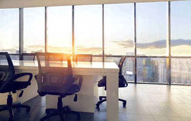 View of office conference room with sunset light in windows
