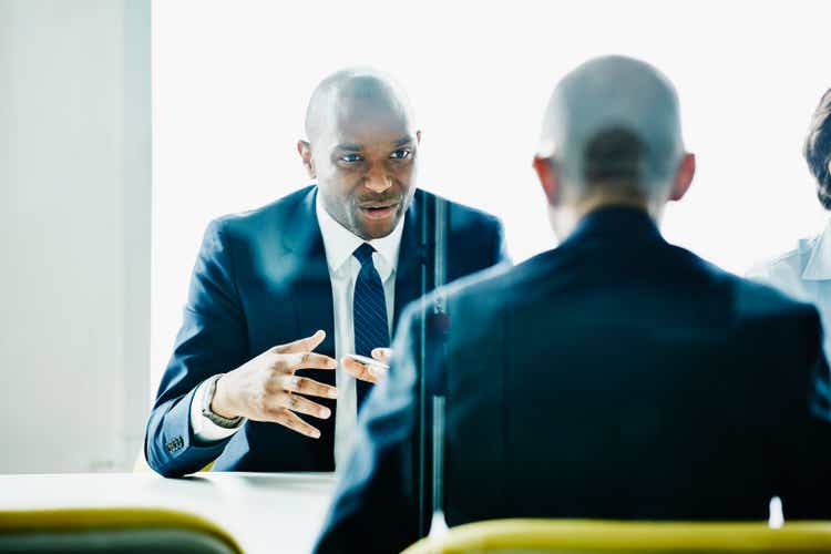 Businessman leading discussion during meeting